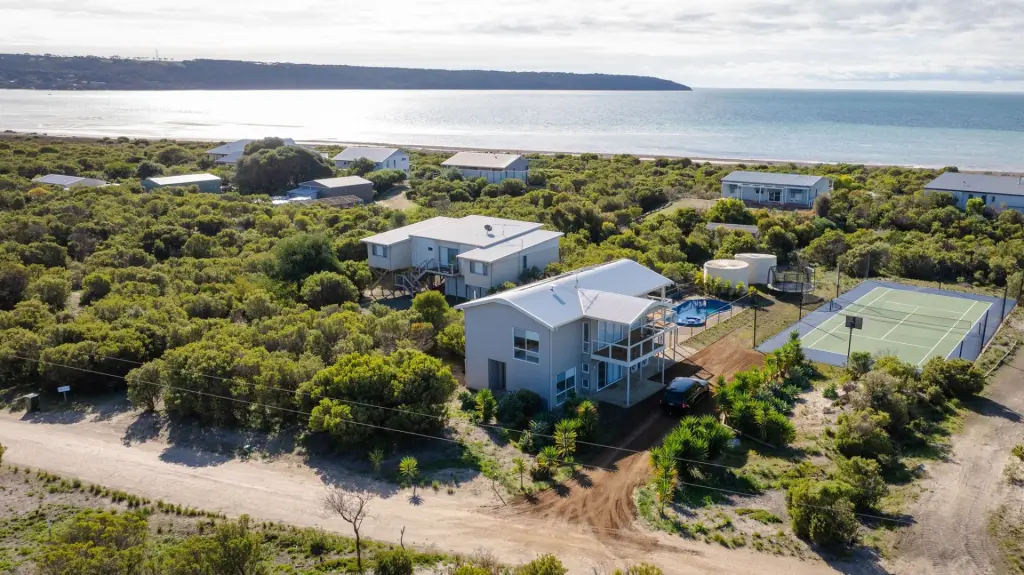 Aerial view of Island Beach House with pool and tennis court, Kangaroo Island
