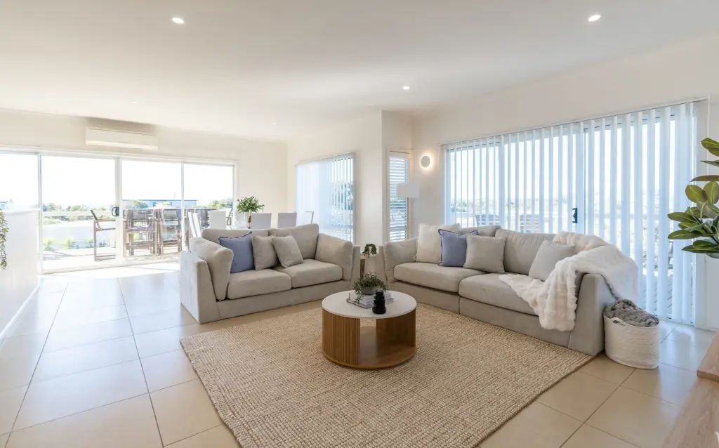 Open-plan living and dining area with sea views