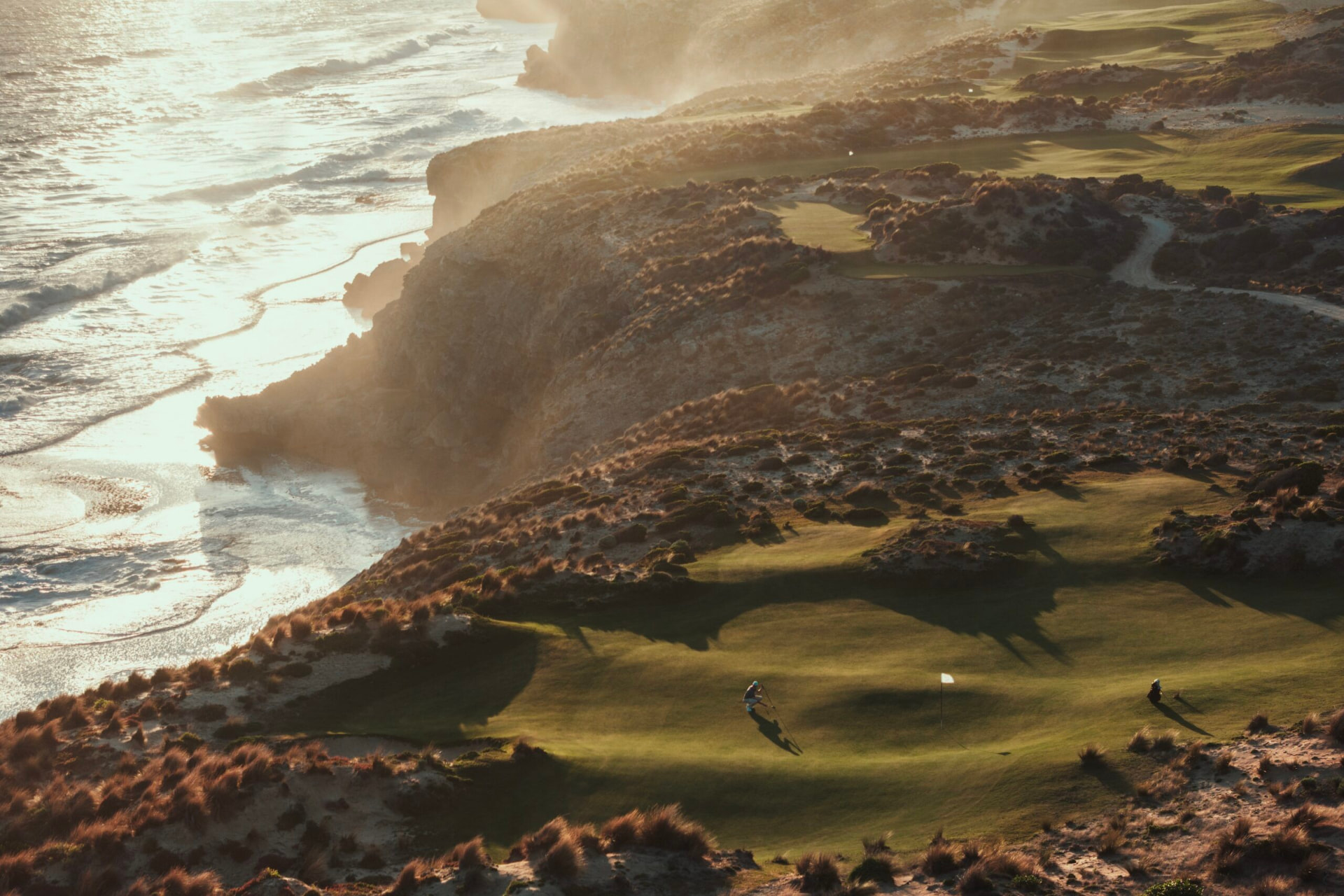 Golfers on a cliff-top green above the Southern Ocean at The Cliffs Kangaroo Island
