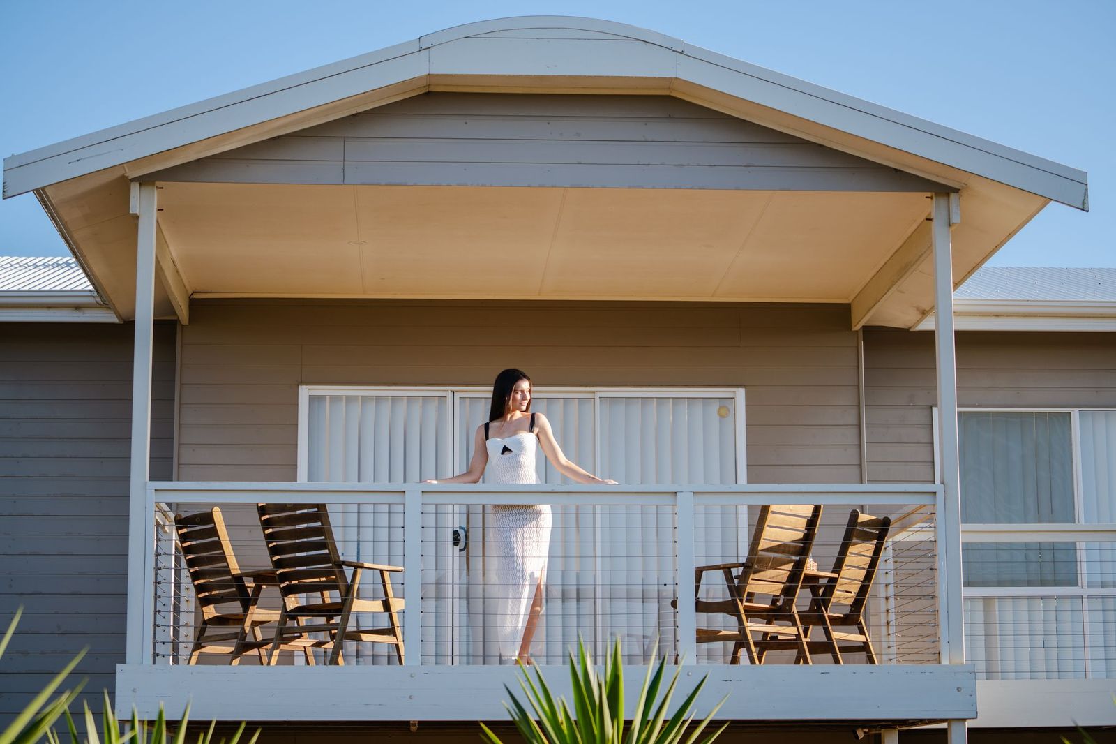 Guest relaxing on the Island Beach House deck